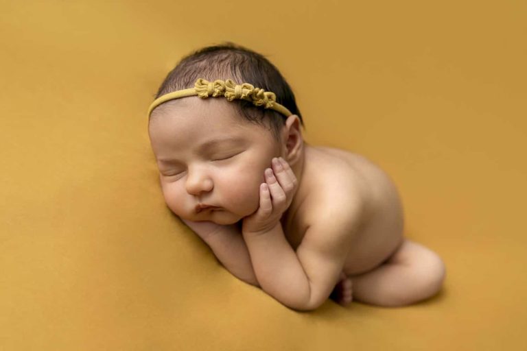 Newborn Photography Melbourne baby on mustard backdrop