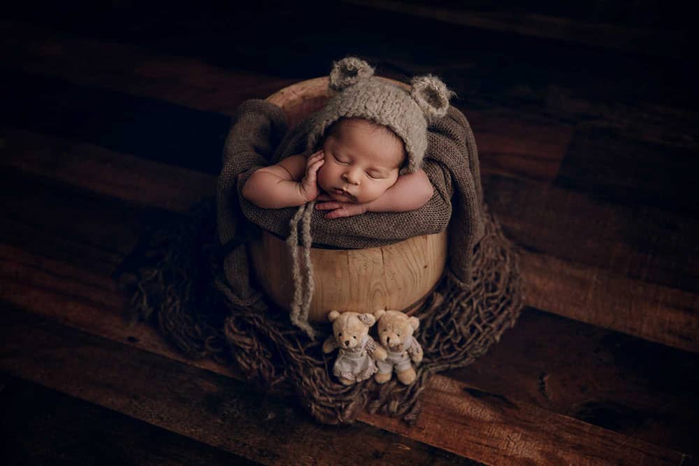 Newborn Baby posed in bucket